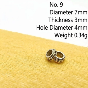 Macro detail of vintage silver spacer bead with size specs 7mm diameter and 4mm hole