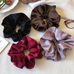 Set of four glossy satin scrunchies in black, brown, burgundy and dusty pink colors