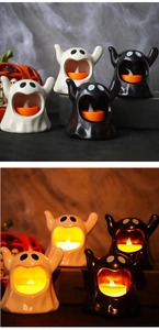 Ceramic ghost candle holder with LED light for Halloween decor in black and white finish