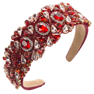 Detail of red velvet headband with luxurious red and pink crystals in baroque style
