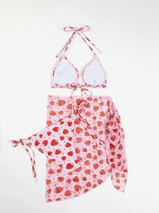 Detailed view of the strawberry print bikini set with matching beach mesh cover-up skirt