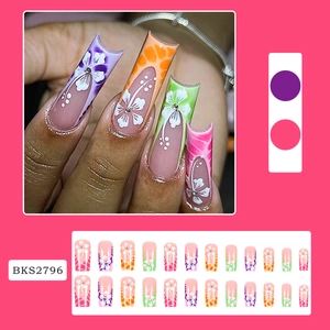 Colorful floral press-on nails with rhinestones in a long trapezoid French style