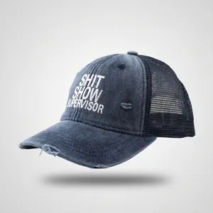 Detailed view of the distressed denim texture and mesh back on this vintage trucker hat