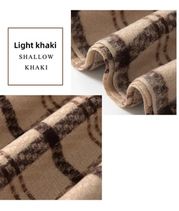 Close-up of the soft cashmere-like textile texture and shallow khaki plaid pattern