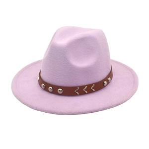 Close-up of light purple wool fedora with brown leather strap and silver metal studs