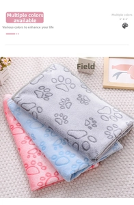 Detailed view of pink, blue, and gray flannel pet blankets with cute paw prints texture