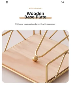 Detail of gold metal frame on thickened wooden base with smooth polished finish