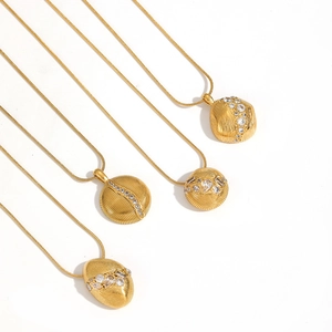 Luxe 18k gold plated stainless steel necklaces with diamond pendants on white background