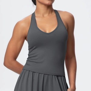 Detail of dark grey V-neck sports bra with moisture-wicking fabric for yoga fitness