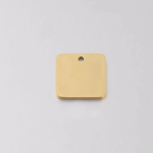 Close-up of golden square stainless steel pendant with polished finish for DIY engraving
