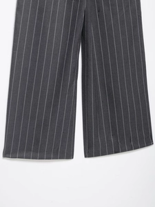 Close-up of charcoal gray striped trousers showing high-quality fabric texture and straight hem