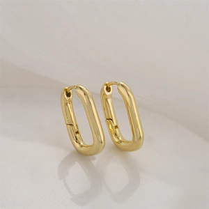 Minimalist 14K gold plated geometric oval hoop earrings with a polished metallic finish