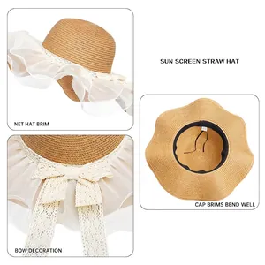 Cappello di paglia da donna con tesa in rete bianca e fiocco di pizzo per la spiaggia