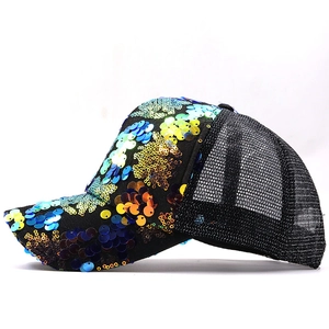 Close-up of vibrant colorful sequins on a breathable mesh trucker baseball cap