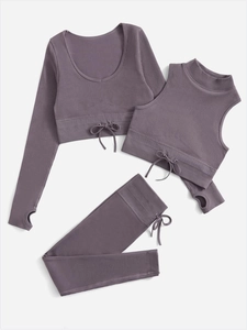 Detailed view of mauve ribbed yoga set featuring drawstring bows and thumbhole sleeves