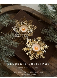 Detailed view of golden metal snowflake candle holder on a festive Christmas wooden base