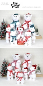 Detailed view of white flocked Christmas polar bears with knit hats and festive scarves