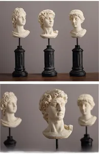 Detailed close-up of Nordic Greek bust statues set on elegant black Roman column bases