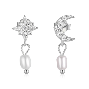 Detailed view of S925 silver star and moon earrings with sparkling zircons and pearls