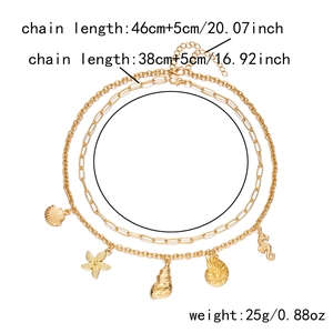 Detail of gold layered ocean necklace showing shell pendants and chain length dimensions