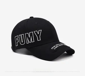 Detailed side view of black cotton baseball cap with bold white FUMY embroidery