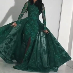 Elegant dark green long sleeve lace embroidered evening gown with a tiered trail skirt