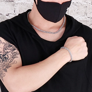 Polished stainless steel chain necklace and bracelet set for men on casual model