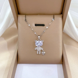 Luxury titanium steel bear pendant necklace with sparkling zircons in a beige jewelry box