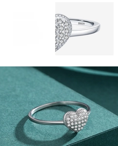 Macro detail of S925 sterling silver stamp and heart ring with pavé cubic zirconia