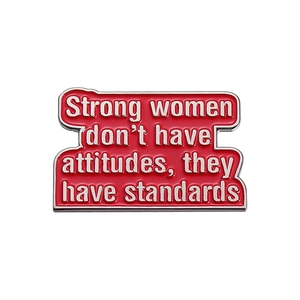 Red enamel strong women standards pin with silver trim on white background