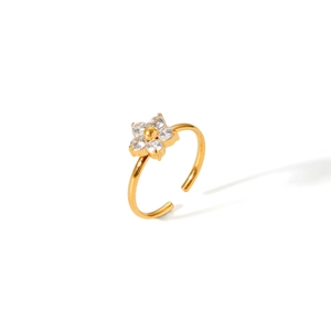Detail of gold open ring featuring a zircon-studded flower design with smooth metallic shine
