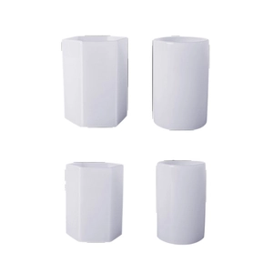 Set of four white hexagonal and cylindrical resin molds for desk or office storage