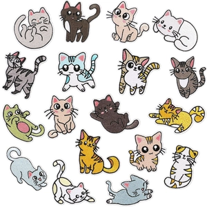 Detailed view of 16 different colorful cartoon cat embroidery patches on white background