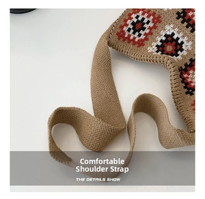 Detail of knitted shoulder strap with colorful ethnic jacquard patterns on khaki tote bag