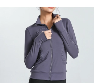 Close-up of slim-fit yoga jacket with ruffled hem and thumbhole sleeve detail