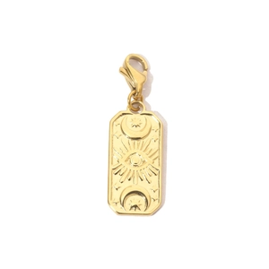 Detail of a gold rectangular sun and moon pendant with lobster clasp and cubic zirconia
