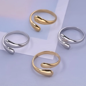 Polished teardrop-shaped open rings in gold and silver finish with adjustable bands