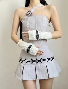 Detail of grey y2k fingerless knit sleeves with black buckles and lace-up corset dress