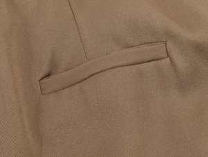Macro shot of khaki twill midi skirt fabric detail and fine stitching on welt pocket
