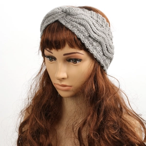 Detail showing the gray chunky knit texture and stylish twisted knot of the warm headband