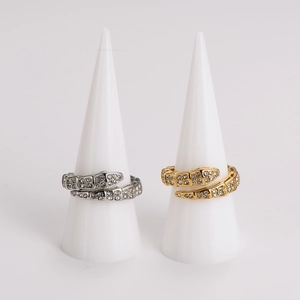 Adjustable snake rings in gold and silver steel finishes with crystal embellishments