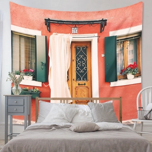 Detail of bohemian tapestry featuring Mediterranean orange architecture and rustic wooden doors