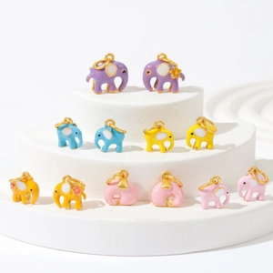 Set of 12 colorful enamel elephant charms for DIY jewelry making on white display steps