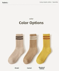 Detailed knit texture of wool mid-calf socks with retro stripes in warm earthy tones