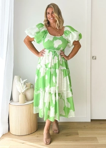 Detail of green and white floral puff sleeves and elastic high waist on summer dress