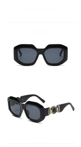 Detail view of black vintage polarized sunglasses with circular metal hinge accents