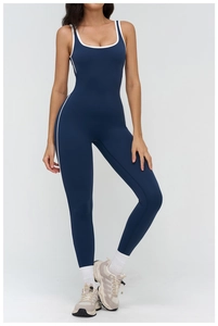 Detail of navy yoga bodysuit featuring contrast white piping and square neckline design