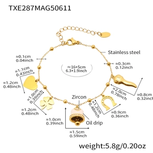 Detail of a gold stainless steel bracelet with oil-dripping charms and zircons