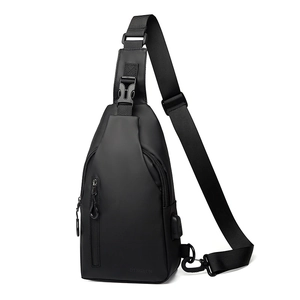 Waterproof black outdoor chest bag with USB charging port and adjustable shoulder strap