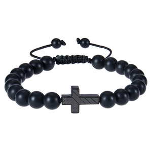 Macro shot of 8mm matte black stone beads bracelet with a detailed metal cross pendant